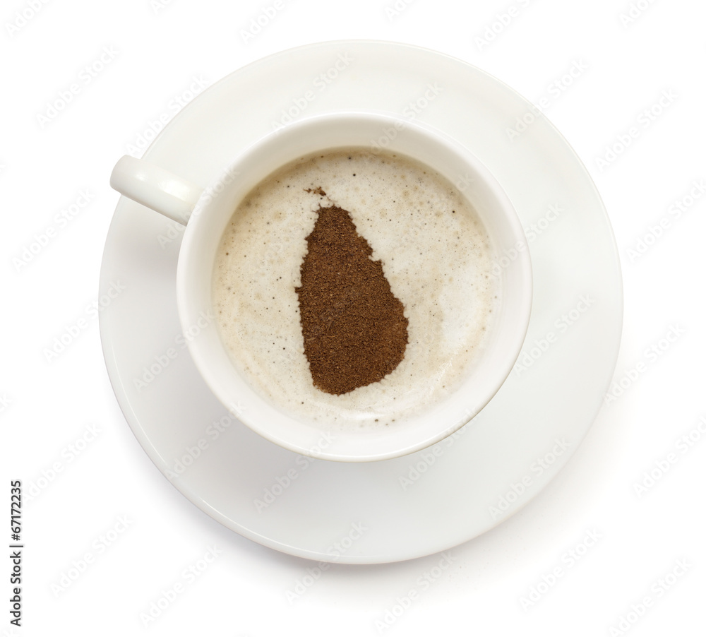 Cup of coffee with foam and powder in the shape of Sri Lanka.(se Cup of coffee with foam and powder in the shape of Sri Lanka.(se