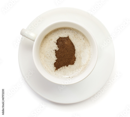 Cup of coffee with foam and powder in the shape of South Korea.(