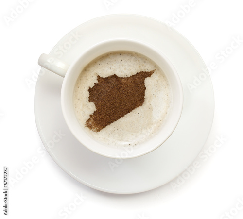 Cup of coffee with foam and powder in the shape of Syria.(series