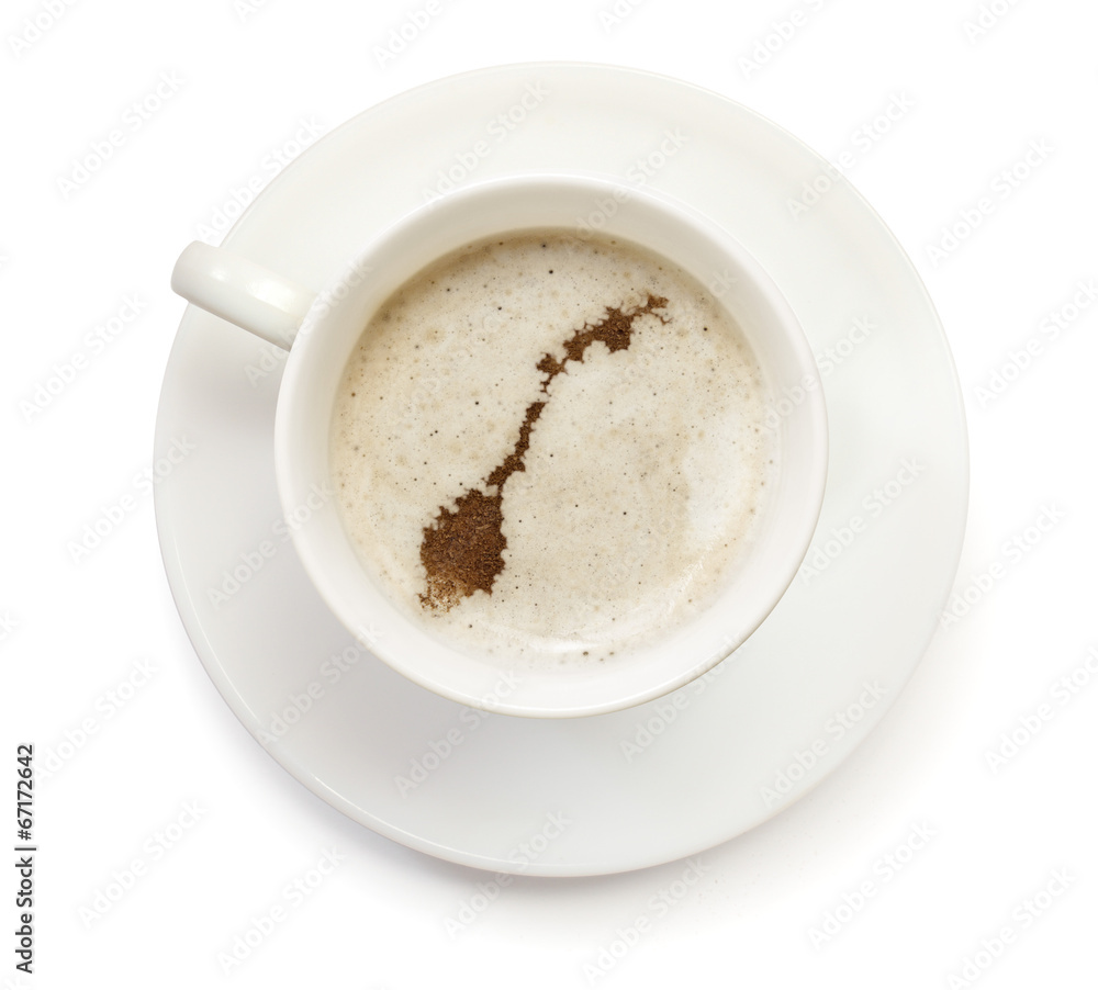 Cup of coffee with foam and powder in the shape of Norway.(serie Cup of coffee with foam and powder in the shape of Norway.(serie