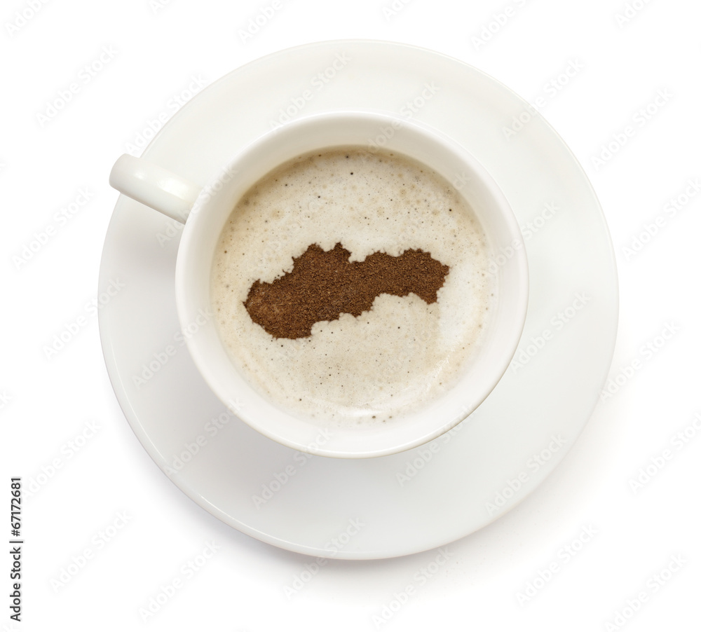 Cup of coffee with foam and powder in the shape of Slovakia.(ser Cup of coffee with foam and powder in the shape of Slovakia.(ser