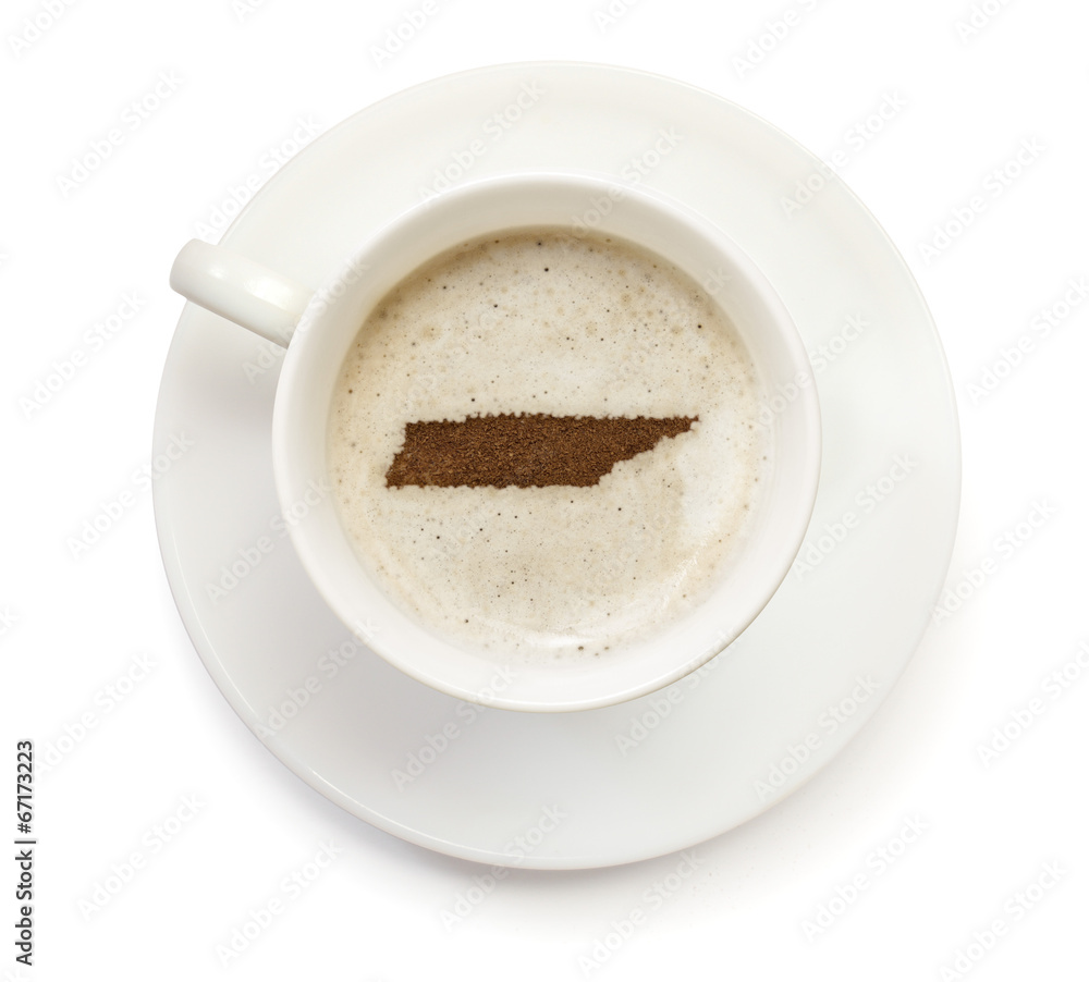 Cup of coffee with foam and powder in the shape of Tennessee.(se Cup of coffee with foam and powder in the shape of Tennessee.(se
