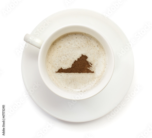 Cup of coffee with foam and powder in the shape of Virginia. ser