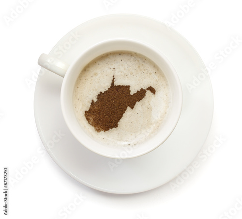 Cup of coffee with foam and powder in the shape of West Virginia
