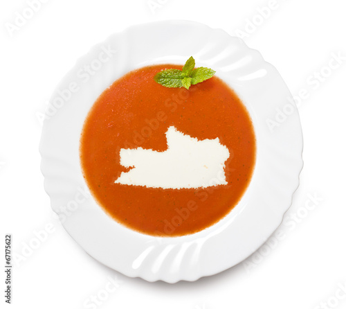 Plate tomato soup with cream in the shape of Russian Federation.