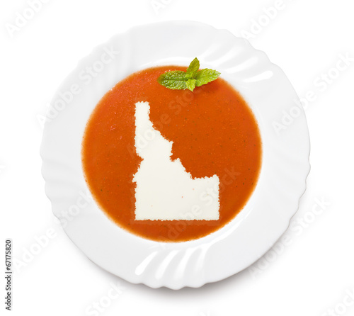 Plate tomato soup with cream in the shape of Idaho.(series)