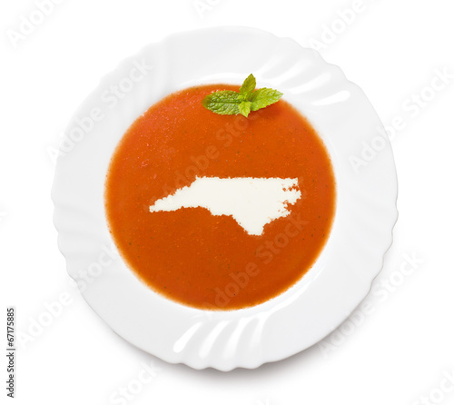 Plate tomato soup with cream in the shape of North Carolina.(ser