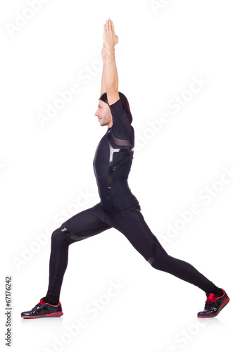 Young man doing exercises on white © Elnur