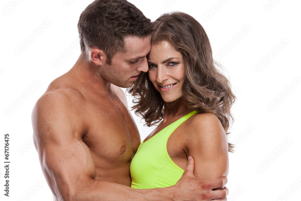sexy couple, muscular man holding a beautiful woman isolated on sexy couple, muscular man holding a beautiful woman isolated on