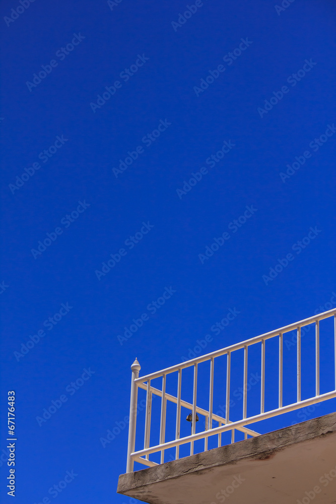 View of the blue sky from a hotel balcony View of the blue sky from a hotel balcony