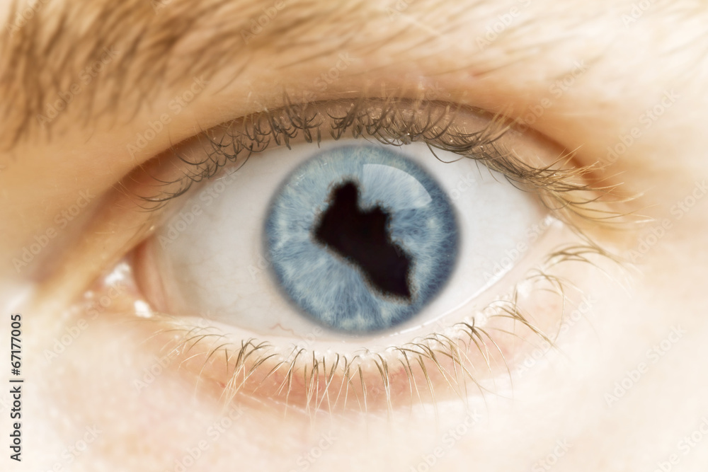 Close-up of an eye with the pupil in the shape of Liberia.(serie Close-up of an eye with the pupil in the shape of Liberia.(serie