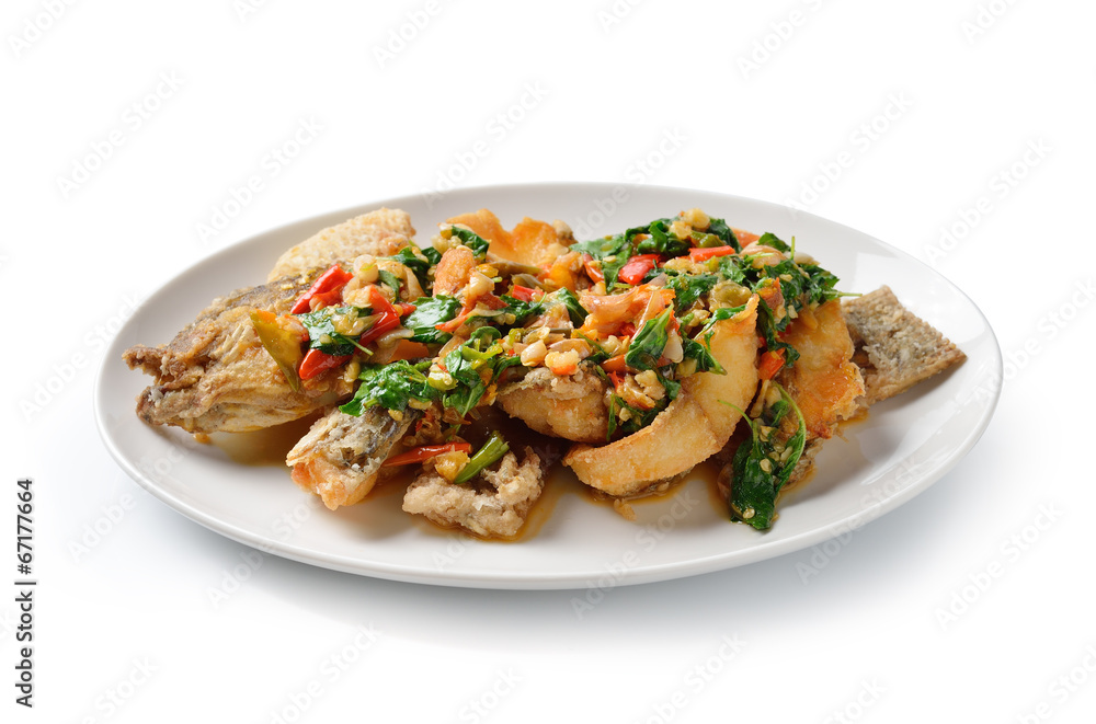 Fried fish with chilli and spices, delicious food Thailand style Fried fish with chilli and spices, delicious food Thailand style