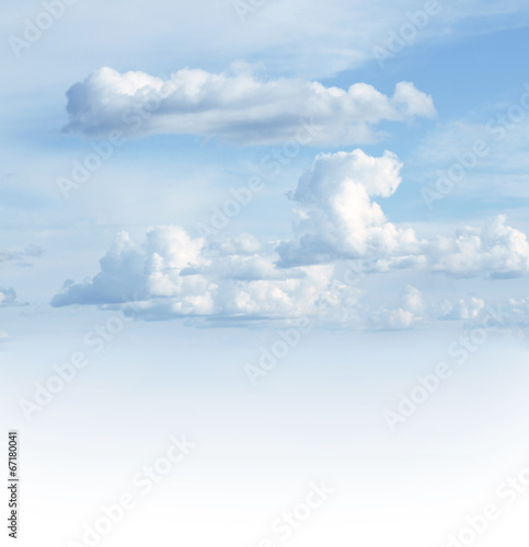 Soft white clouds in blue sky. Copy space