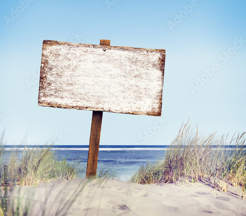 Beach with Empty Plank Sign photo