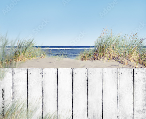 Beach and White Wooden Fence