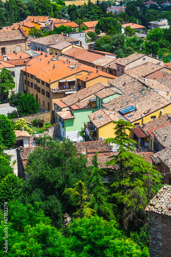 andscape with roofs of houses in small tuscan town in province photo