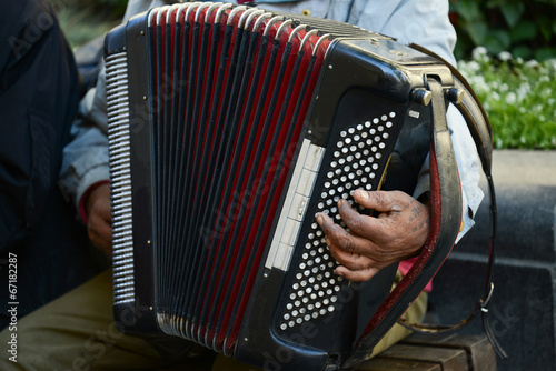 Man at street playing accordion