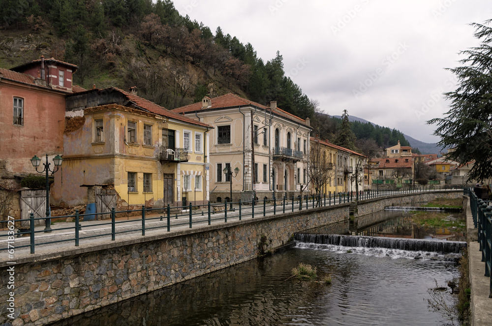 Old neoclassical buildings by the river in Florina, Greece