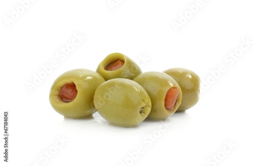 Green olives with paprika filling on a white background