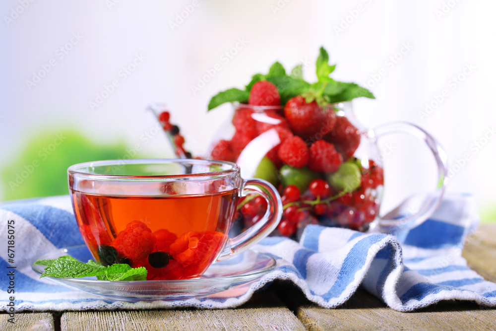 Fruit red tea with wild berries in glass cup, Fruit red tea with wild berries in glass cup,