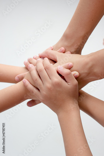 Family hands connected together on isolated background