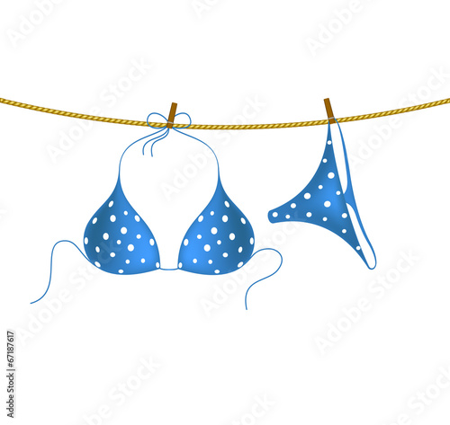 Bikini suit with white dots hanging on rope
