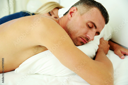 Portrait of couple sleeping in the bed