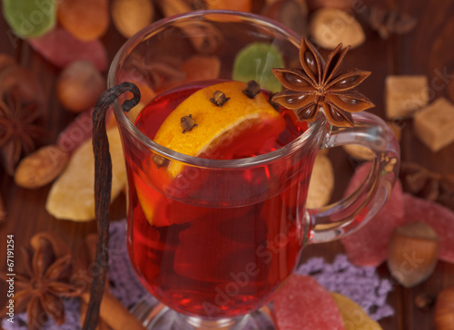 Cup of mulled wine closeup and various spices
