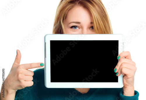Young cheerful woman is showing blank tablet
