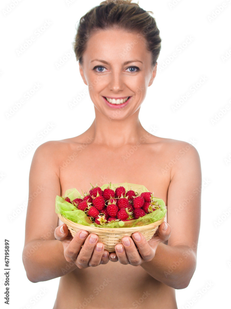 Close up of smiling woman holding raspberries Close up of smiling woman holding raspberries