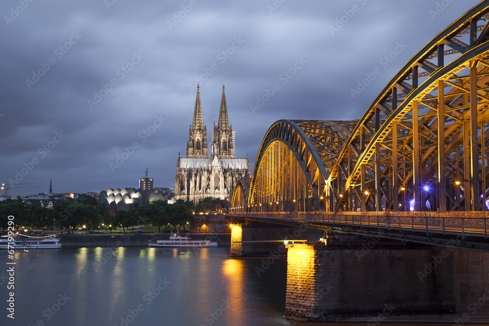 Cologne Cathedral and Hohenzollern Bridge in evening