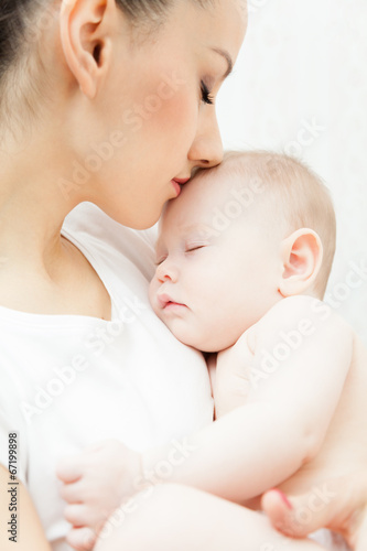 Mother hold little baby girl