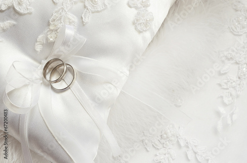 Wedding rings on satin pillow