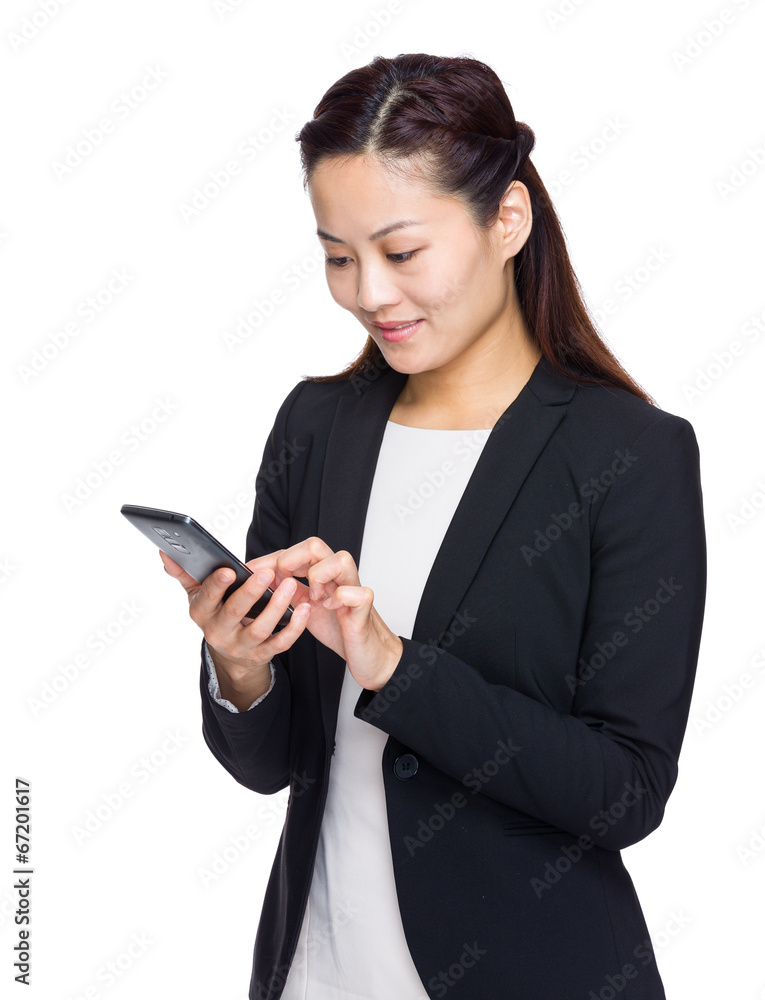 Asian businesswoman look at mobile phone Asian businesswoman look at mobile phone