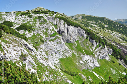 Limestone ridge, Iorgovanului cliff in Retezat mountain, Romania photo