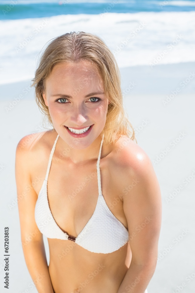 Beautiful blonde in white bikini on the beach Beautiful blonde in white bikini on the beach