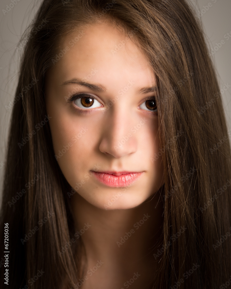 Beautiful young woman with long brown hair Beautiful young woman with long brown hair