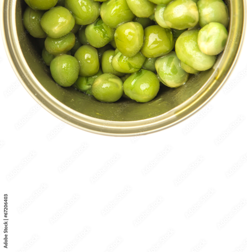 Green peas in a tin can over white background Green peas in a tin can over white background