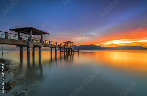 A nice and beautiful sunset on an island jetty © nakata_sahc
