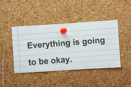 Everything is going to be Okay on a cork notice board photo