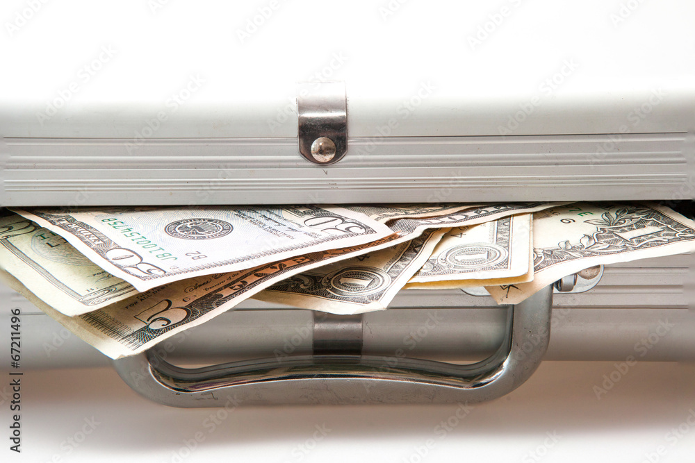 Silver suitcase with Dollar notes showing Silver suitcase with Dollar notes showing