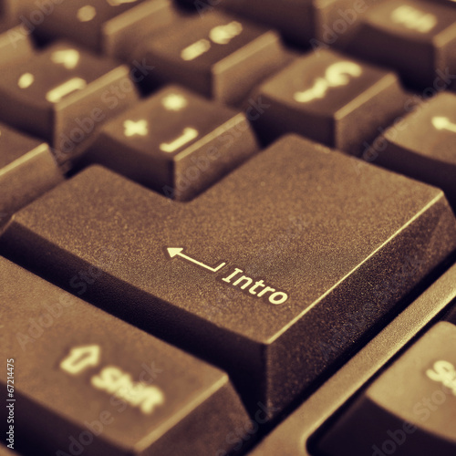 Fotografija intro key of a computer keyboard, with a retro effect