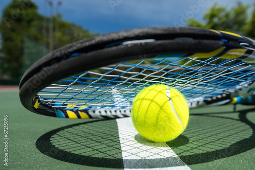 view of tennis racket and balls on the clay tennis court © gawriloff