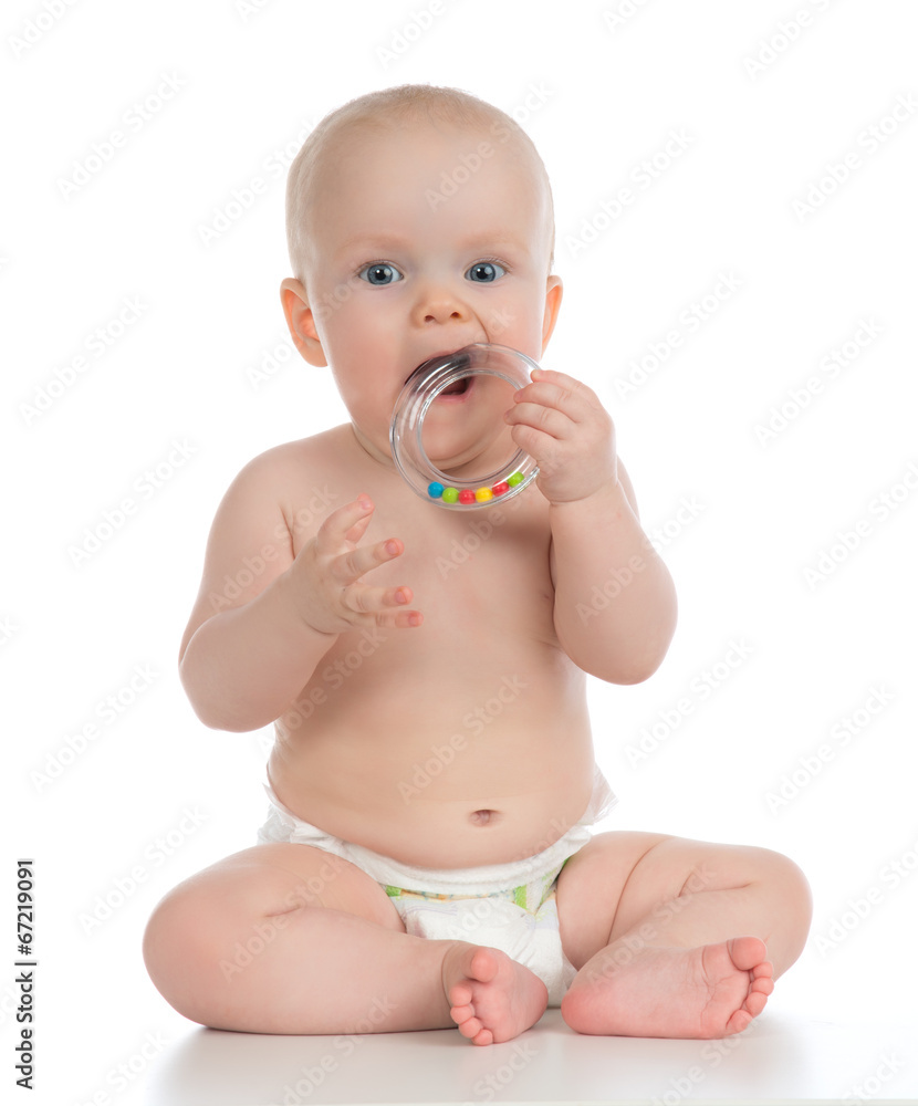Infant child baby boy toddler playing and eating with circle rin Infant child baby boy toddler playing and eating with circle rin