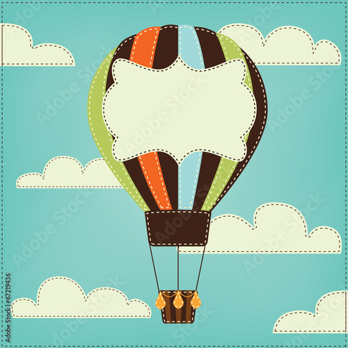 Vintage or retro hot air balloon in sky with clouds