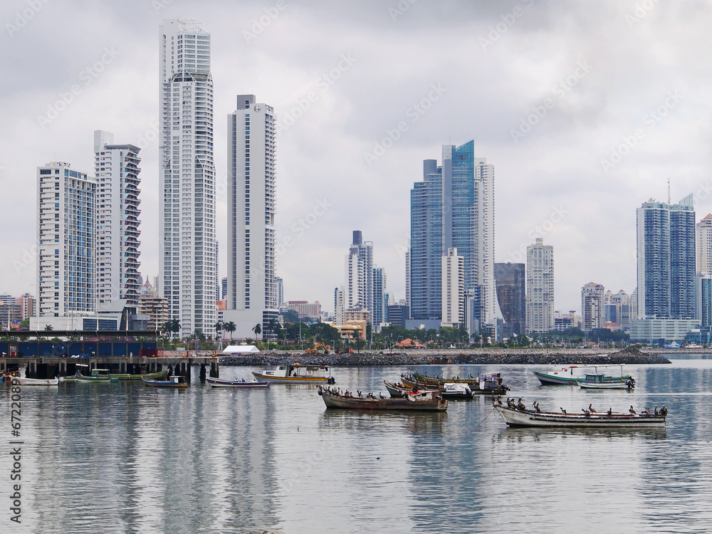 Fishing boats anchored with skyscrapers in Panama