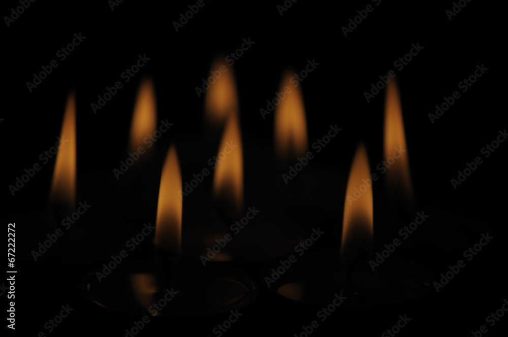 Candle flames isolated over black