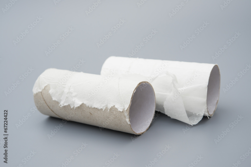 two toilet rollswith the last bit of tissue on grey two toilet rollswith the last bit of tissue on grey