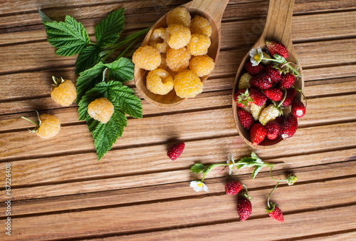 Fototapeta Naklejka Na Ścianę i Meble -  Berries on Wooden Background. Strawberries, Raspberries.