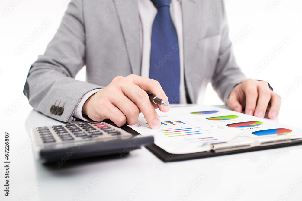 Businessman analyzing investment charts with laptop Businessman analyzing investment charts with laptop